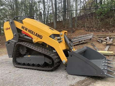 new holland c314 vs case tl tl100 skid steer|case vs new holland video.